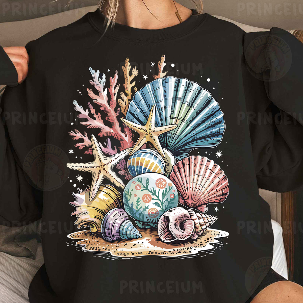 a woman wearing a black shirt with seashells and starfish on it