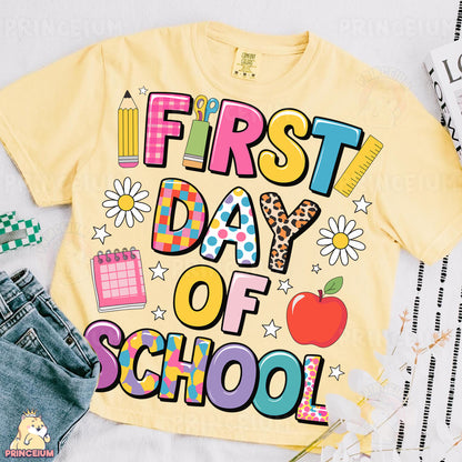 a yellow shirt that says first day of school