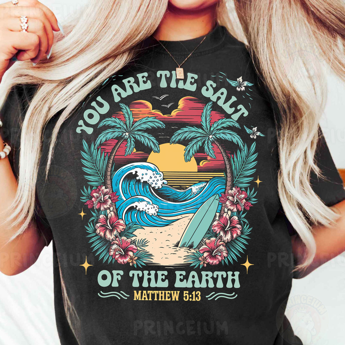 a woman wearing a black shirt with a surfboard and palm trees
