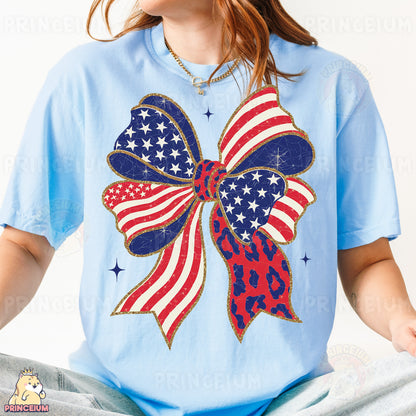 a woman wearing a blue shirt with an american flag bow on it