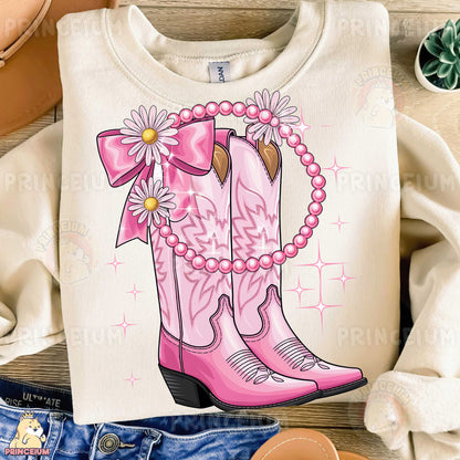 a t - shirt with a pink cowboy boot on it