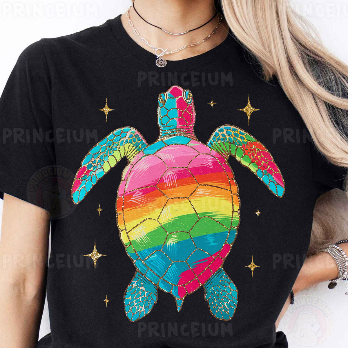 a woman wearing a black shirt with a rainbow turtle on it