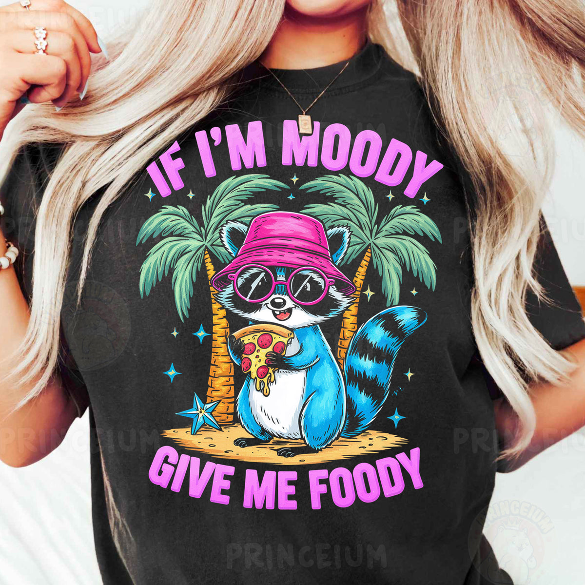 a woman wearing a black shirt with a raccoon wearing a pink hat and