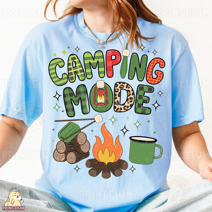 a woman wearing a blue camping mode t - shirt