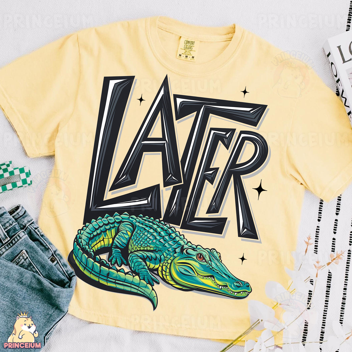 a yellow shirt with a green alligator on it