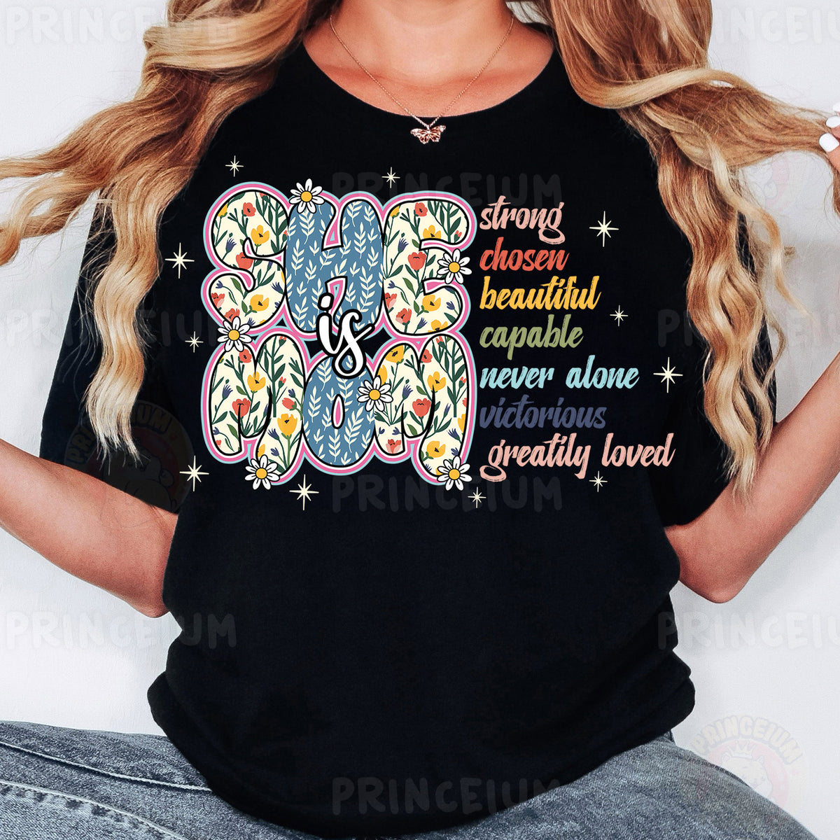 a woman wearing a black t - shirt with an elephant on it