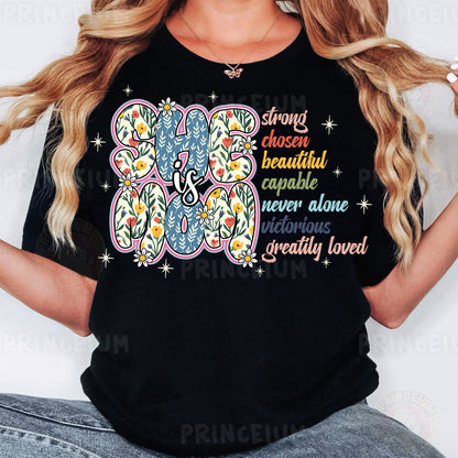 a woman wearing a black t - shirt with an elephant on it