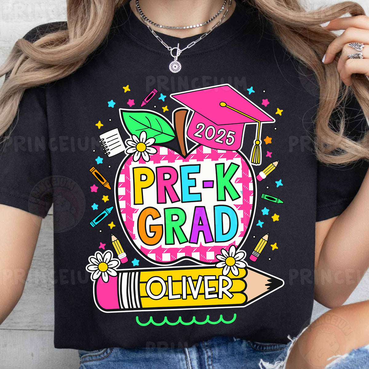 a woman wearing a black t - shirt with the words prek grad on