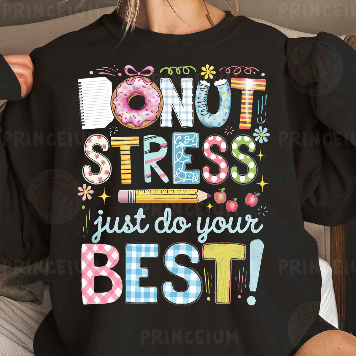 a woman wearing a black shirt that says donut stress just do your best