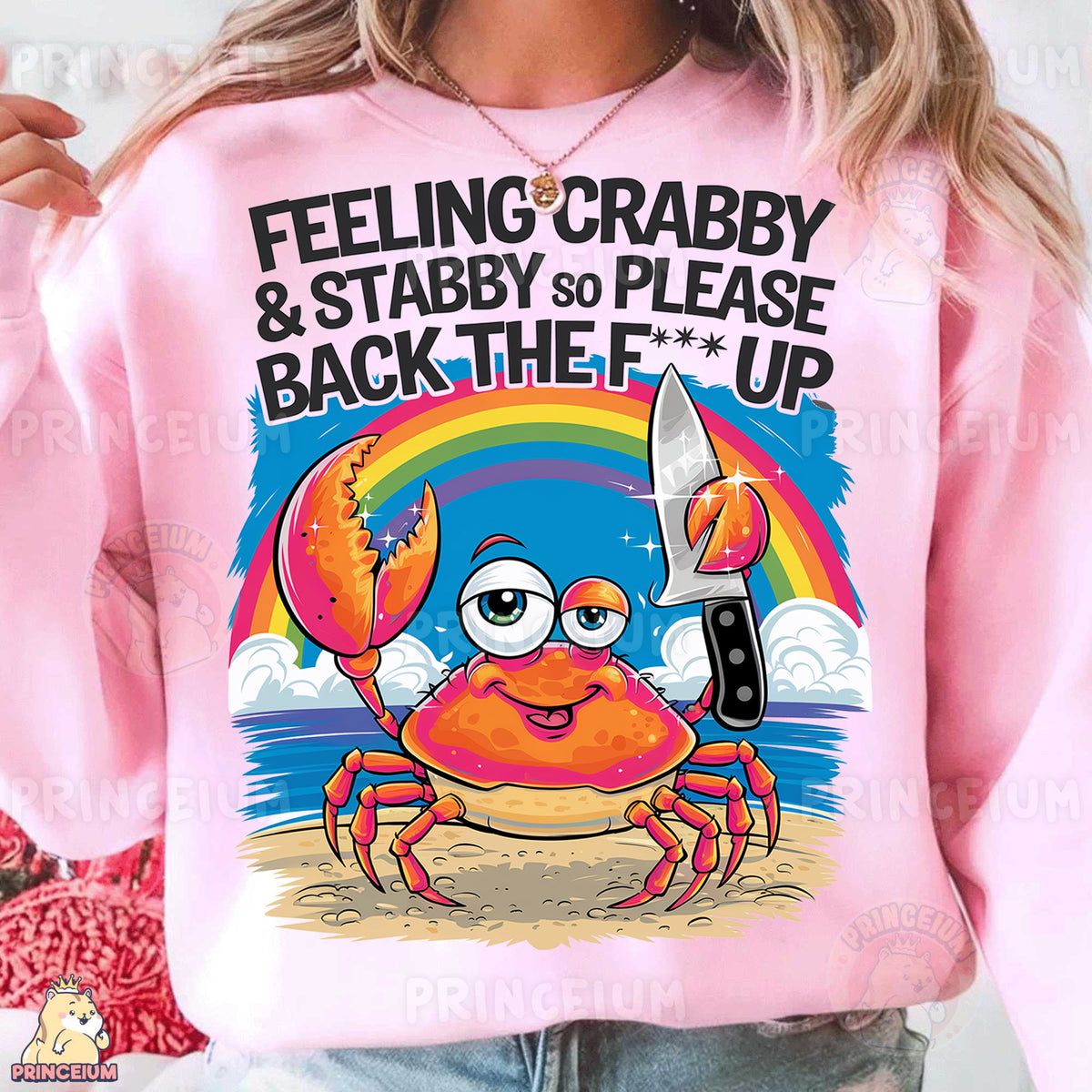 a woman wearing a pink sweatshirt that says feeling crabby and stabby to please