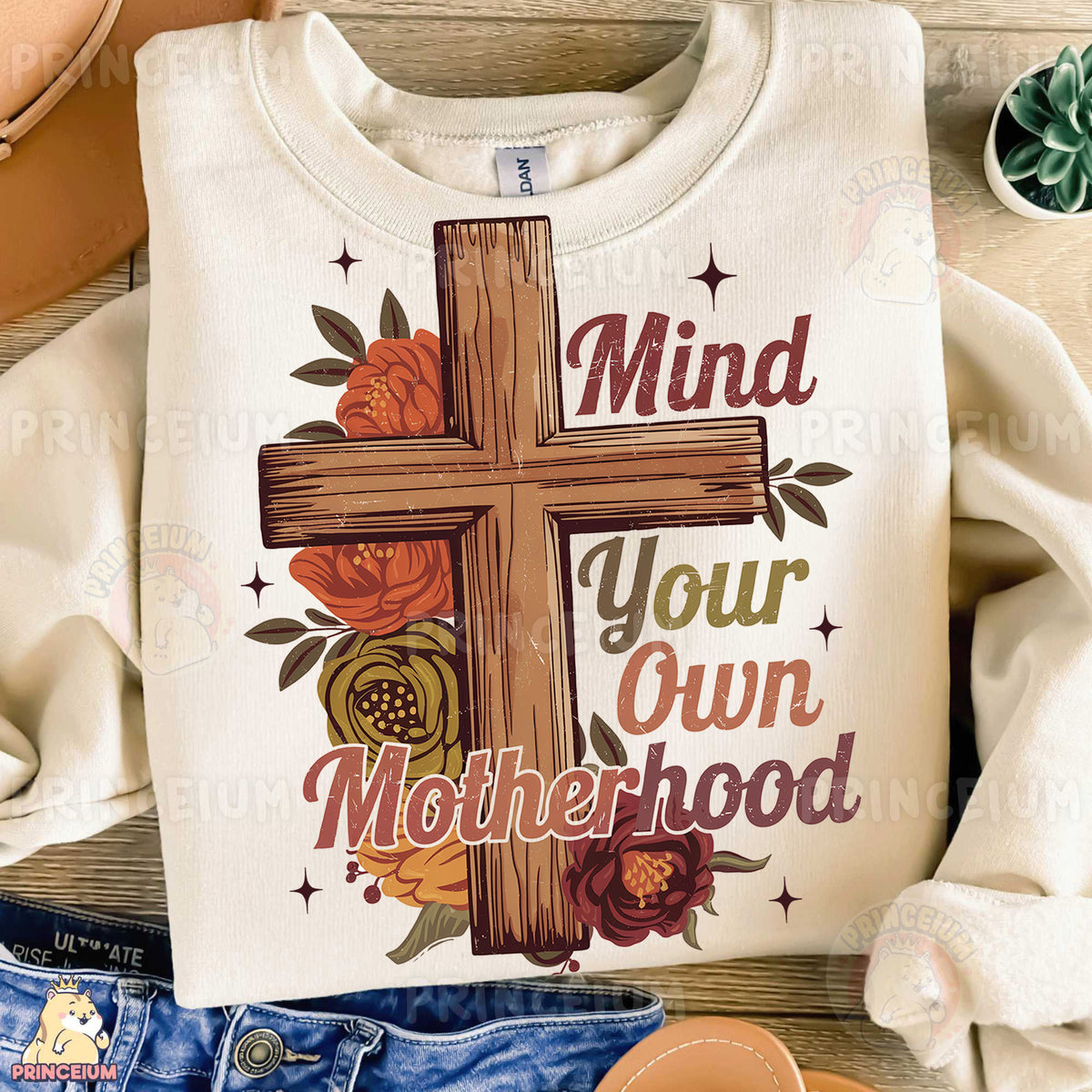 a t - shirt with a cross on it that says mind your own motherhood