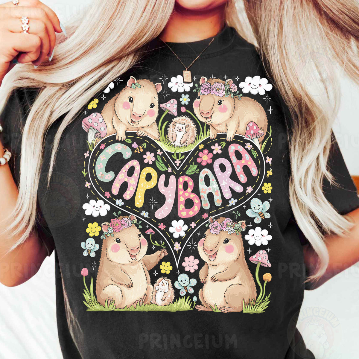 a woman wearing a black t - shirt with a bear heart and flowers on it