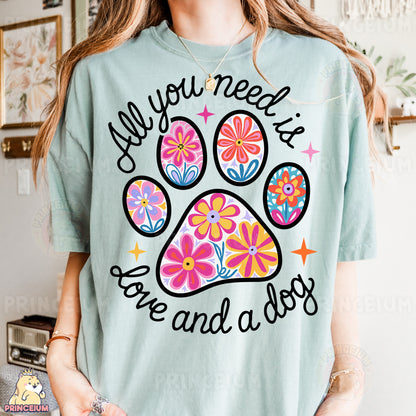 a woman wearing a t - shirt with a dog paw on it