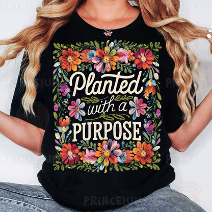 a woman wearing a black t - shirt that says, planted with a purpose