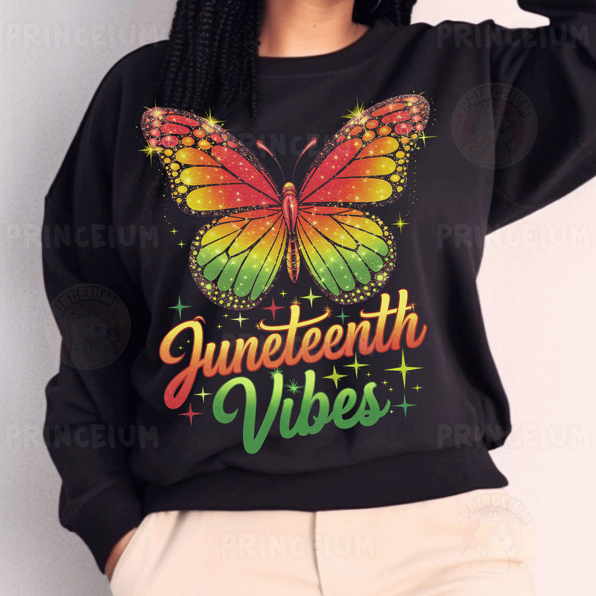 a woman wearing a black sweater with a butterfly on it
