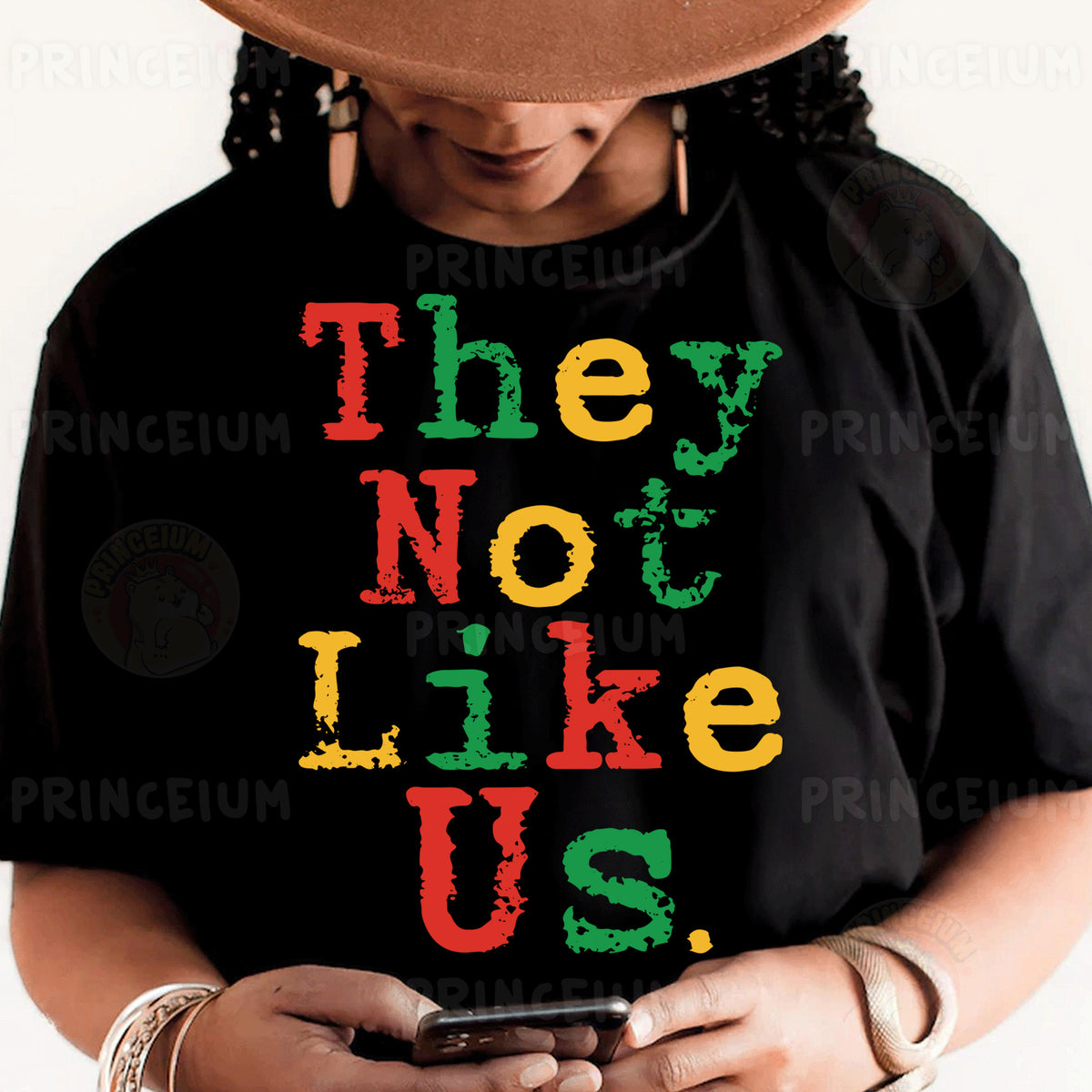 a woman wearing a black shirt with the words they not like us on it