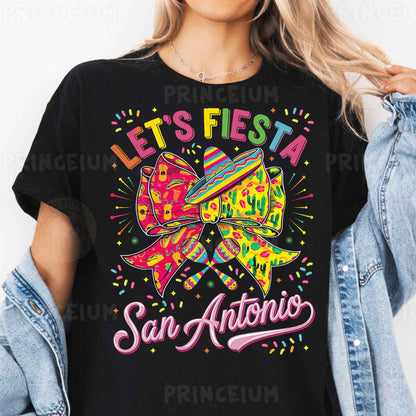 a woman wearing a black tshirt that says let's fiesta san antonio
