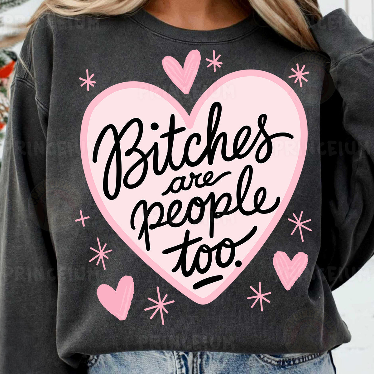 a woman wearing a sweatshirt that says bitches are people too