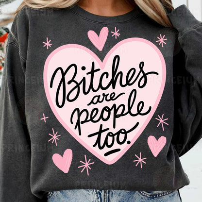 a woman wearing a sweatshirt that says bitches are people too