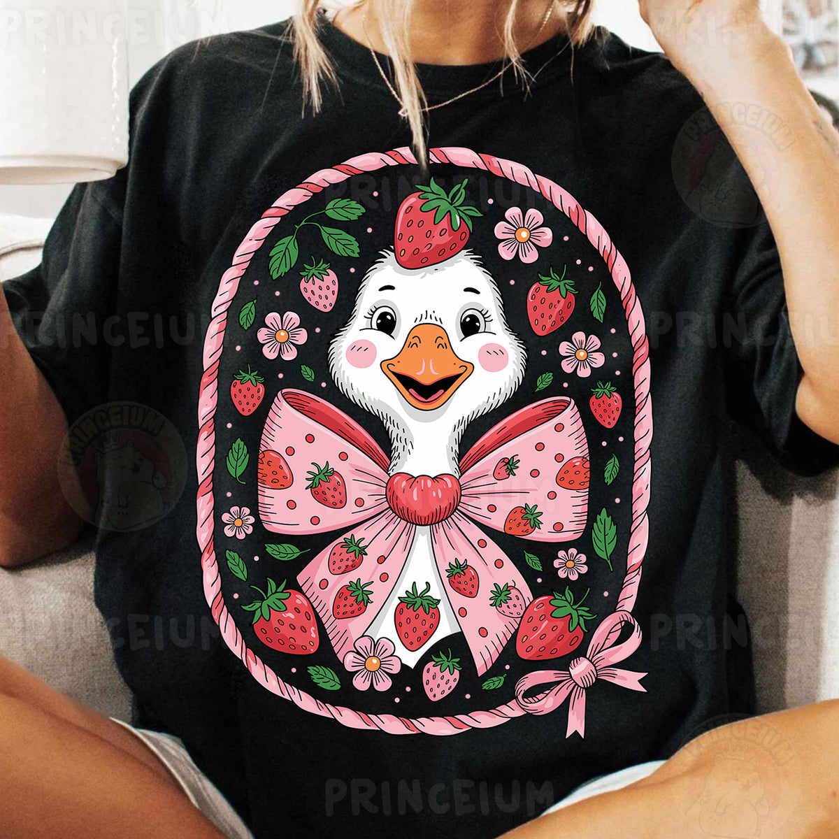 a woman sitting on a couch wearing a t - shirt with a picture of a