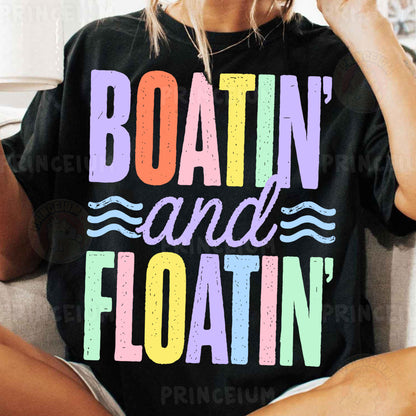 a woman sitting on a couch wearing a boatin and floatin shirt