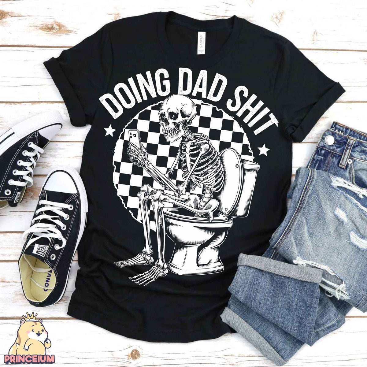 a black shirt with a skeleton sitting on a toilet