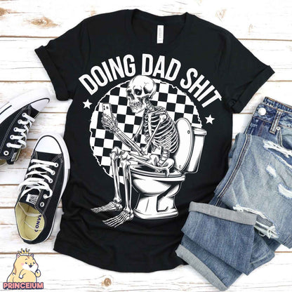 a black shirt with a skeleton sitting on a toilet