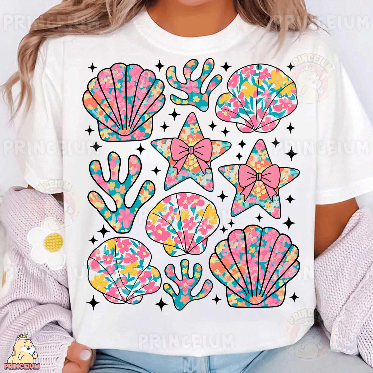a woman wearing a white t - shirt with colorful sea shells on it