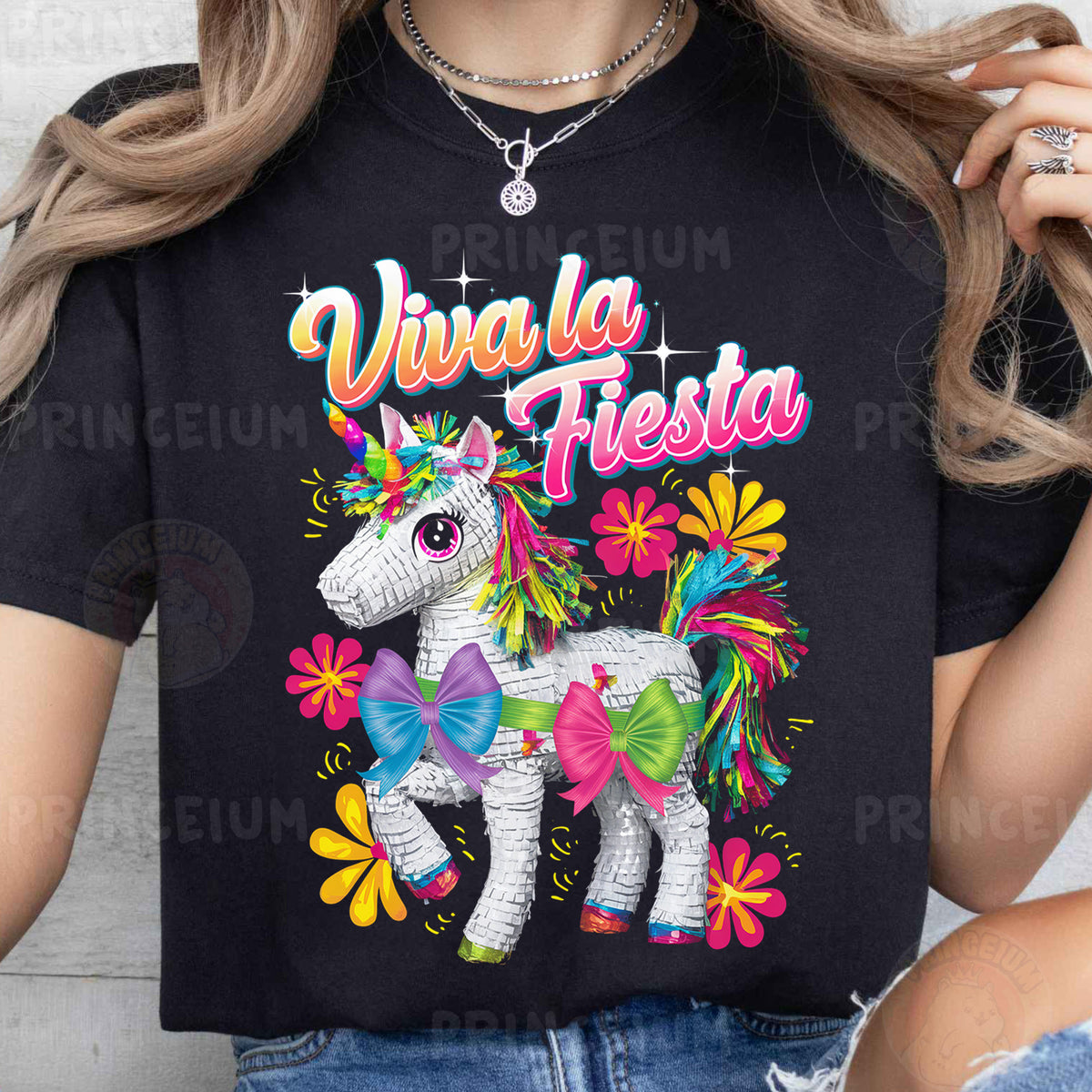 a woman wearing a black shirt with a unicorn on it
