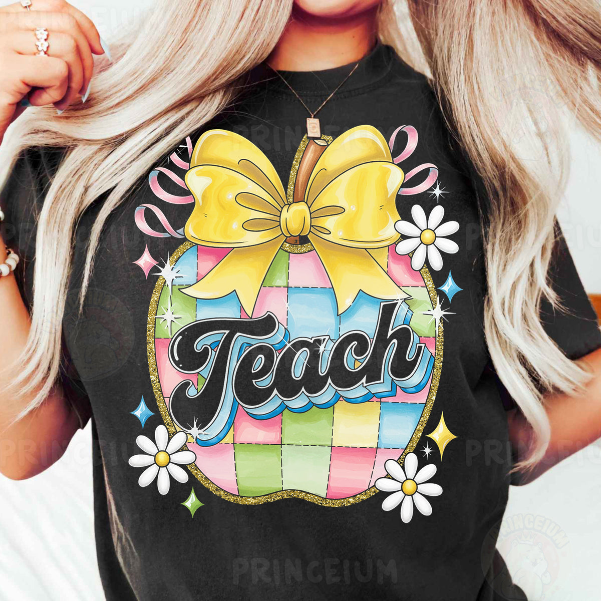 a woman wearing a teacher shirt with a bow