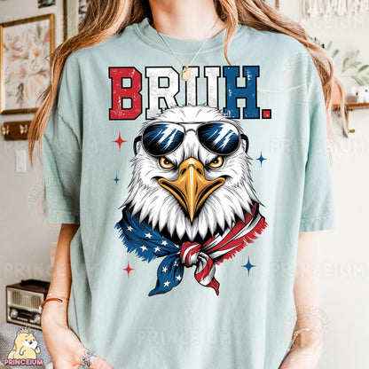 a woman wearing a t - shirt with an eagle wearing sunglasses