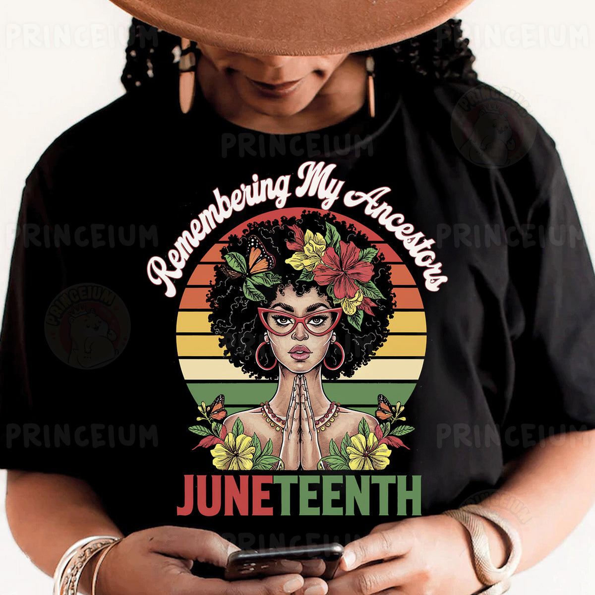 a woman wearing a black shirt and a hat holding a cell phone