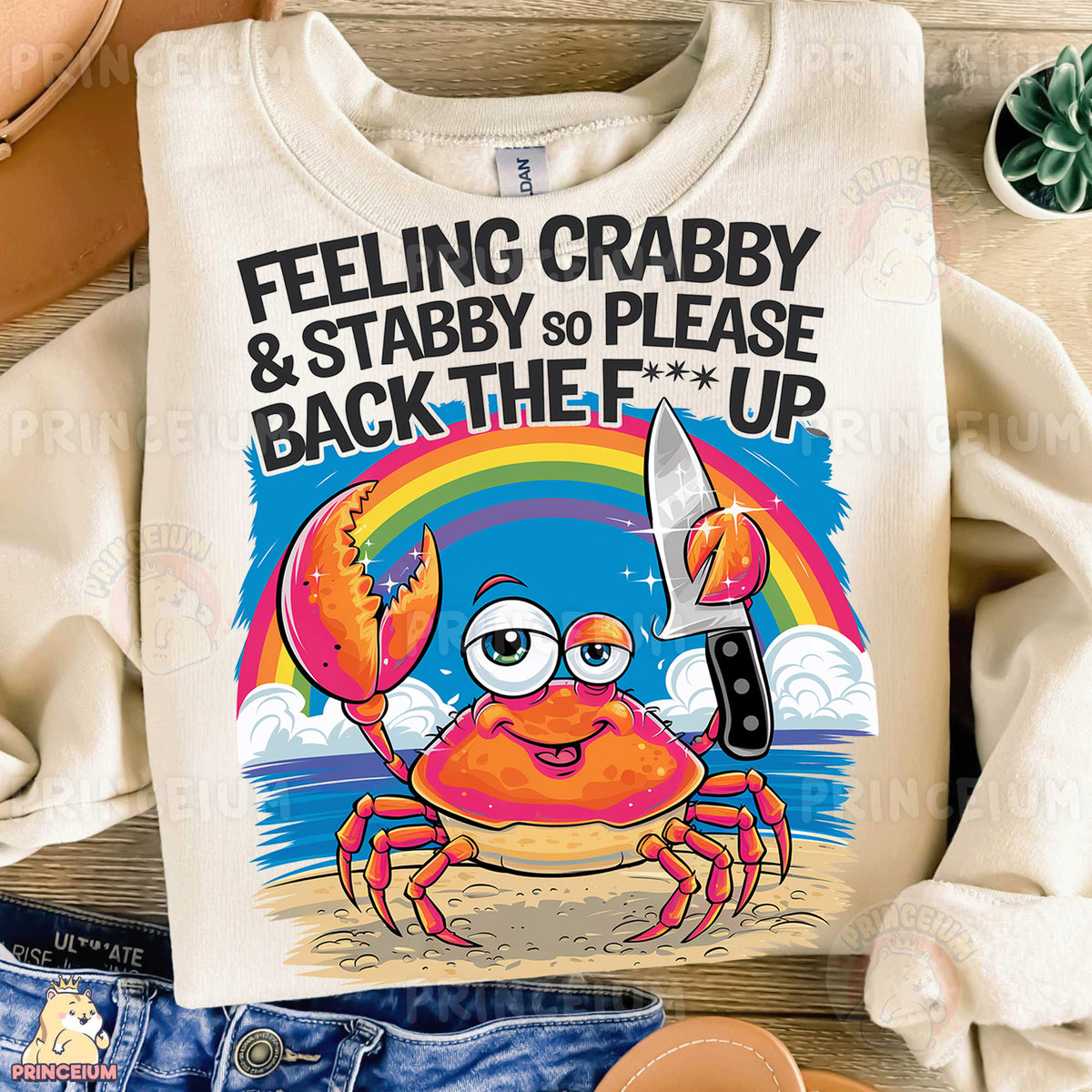 a t - shirt with a crab holding a knife