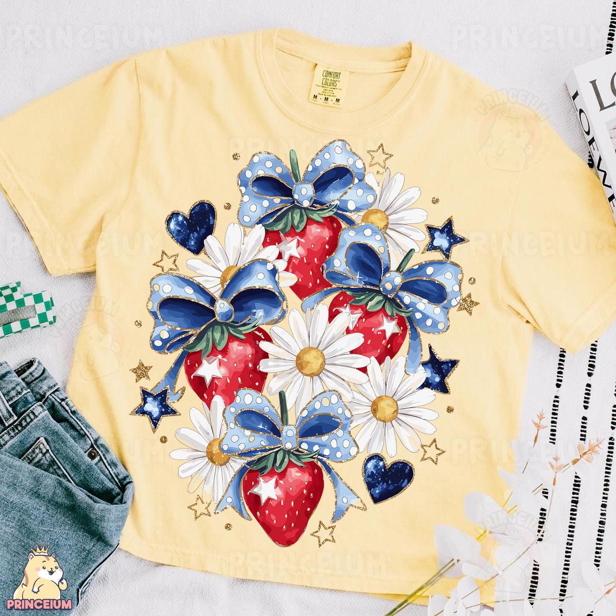 a yellow shirt with a strawberry and daisies on it