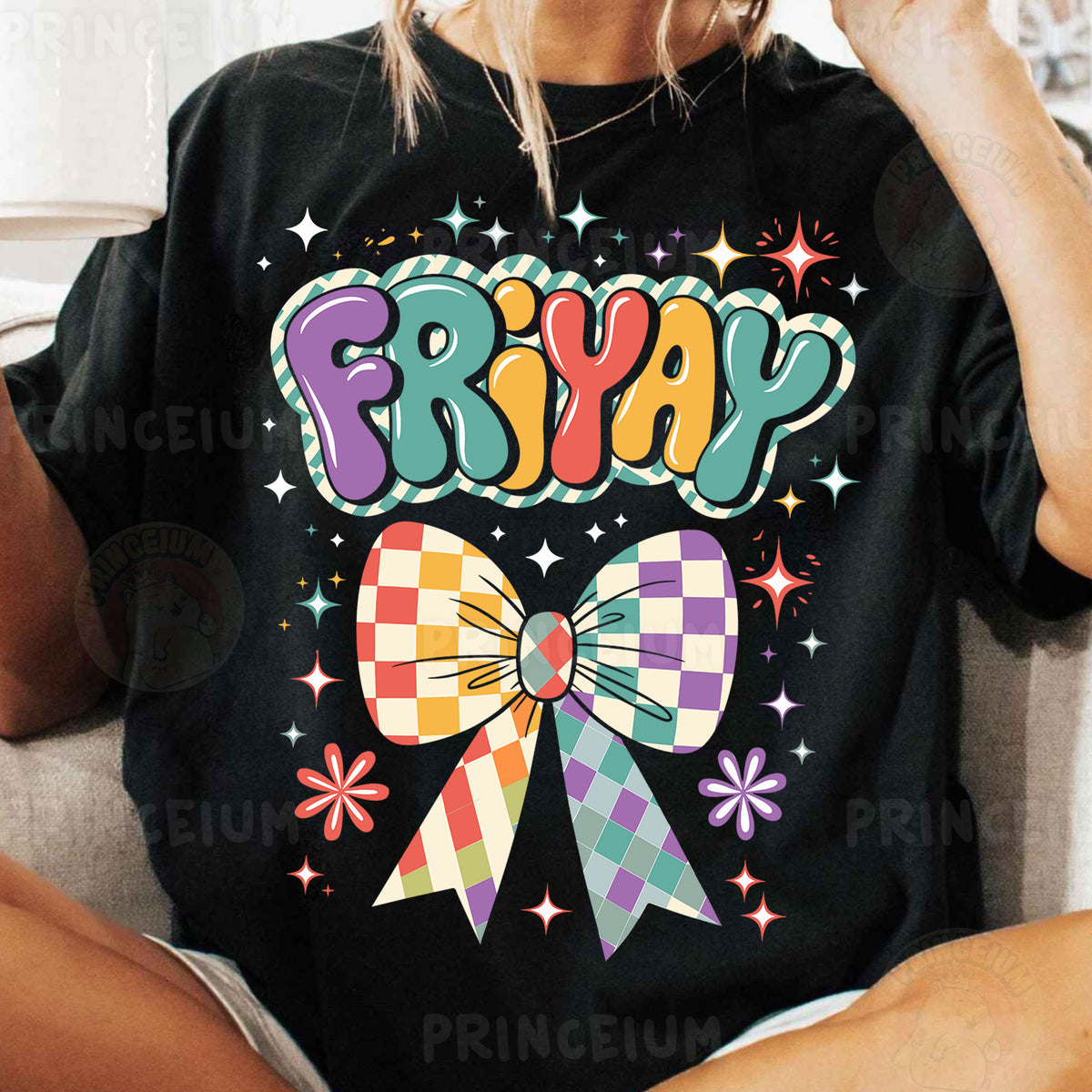 a woman sitting on a couch wearing a black friyap shirt