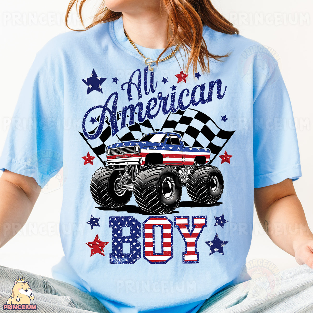 a girl wearing a blue shirt with a monster truck on it