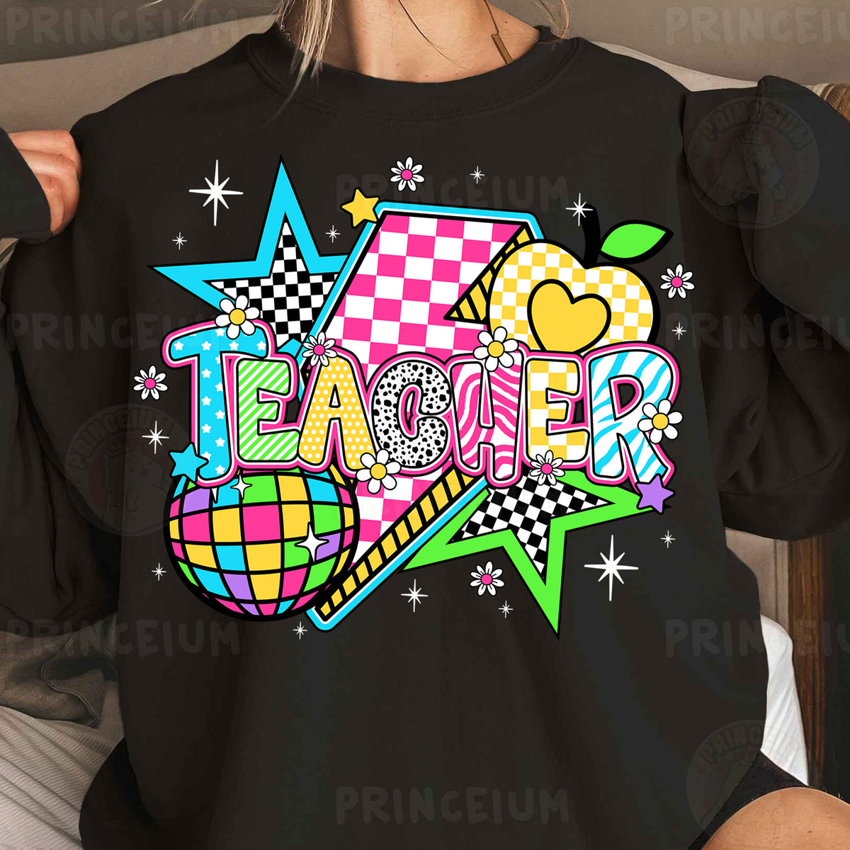 a woman wearing a black teacher shirt with a checkerboard design