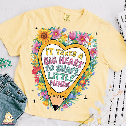 a t - shirt that says it takes a big heart to shape little minds