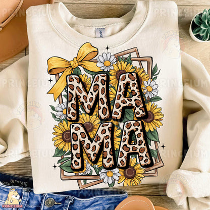 a t - shirt with a sunflower and the word ma ma on it