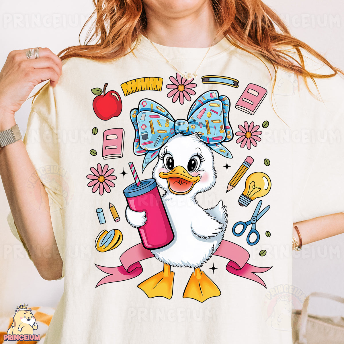 a woman wearing a t - shirt with a picture of a duck holding a drink