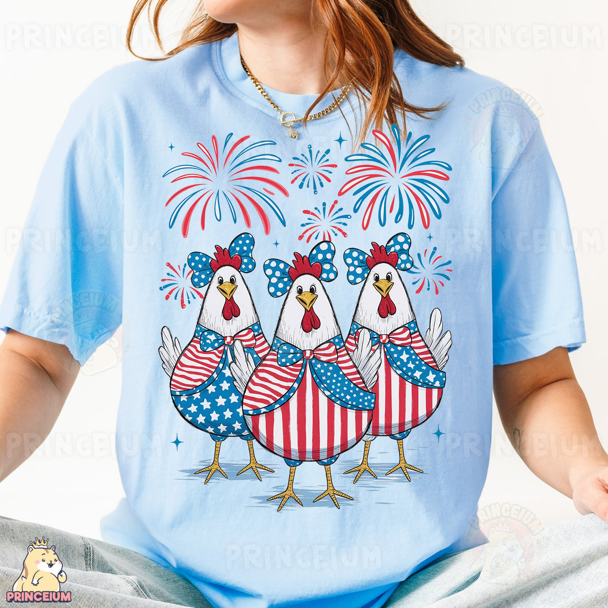 a woman wearing a blue t - shirt with three chickens on it