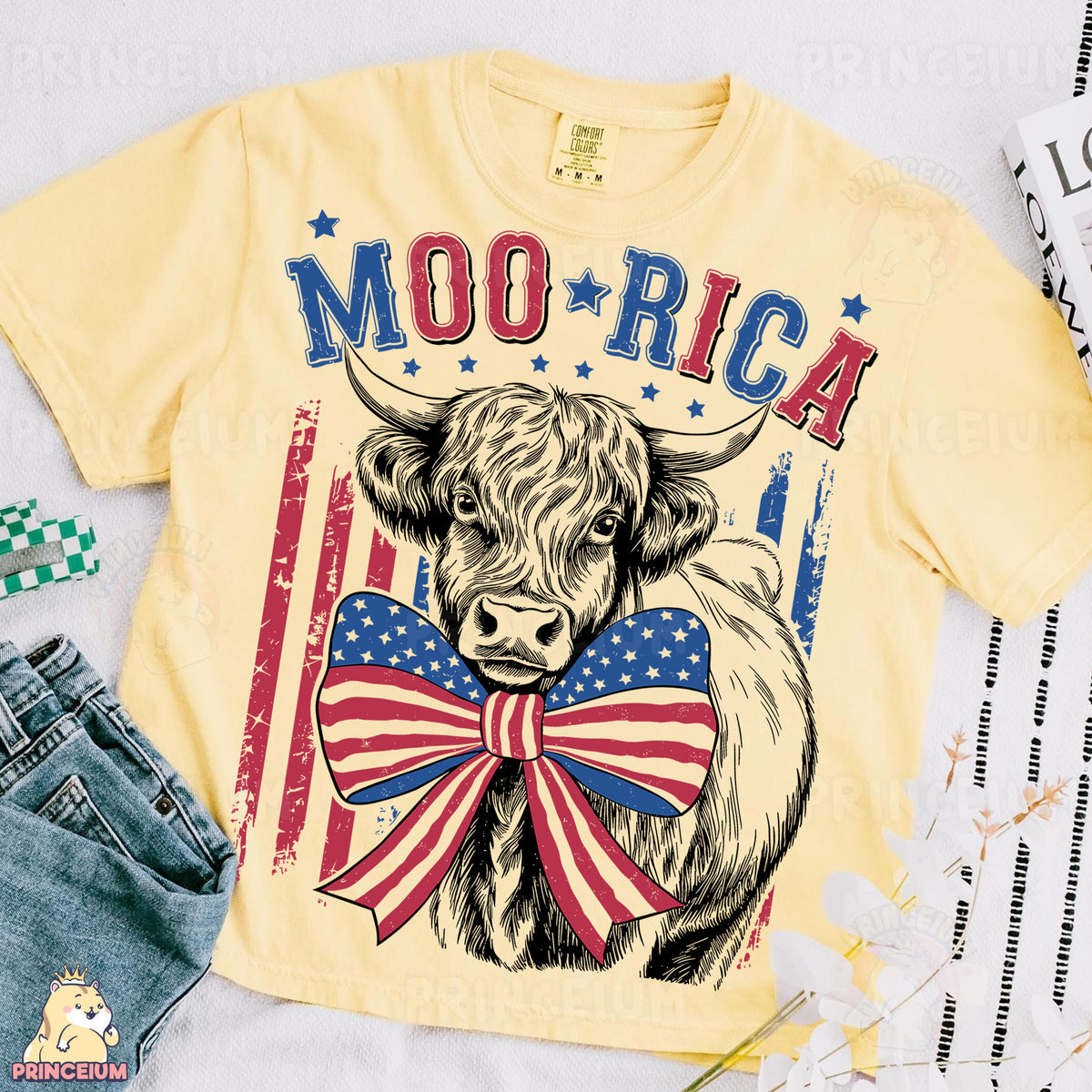 a yellow shirt with a cow wearing a bow tie