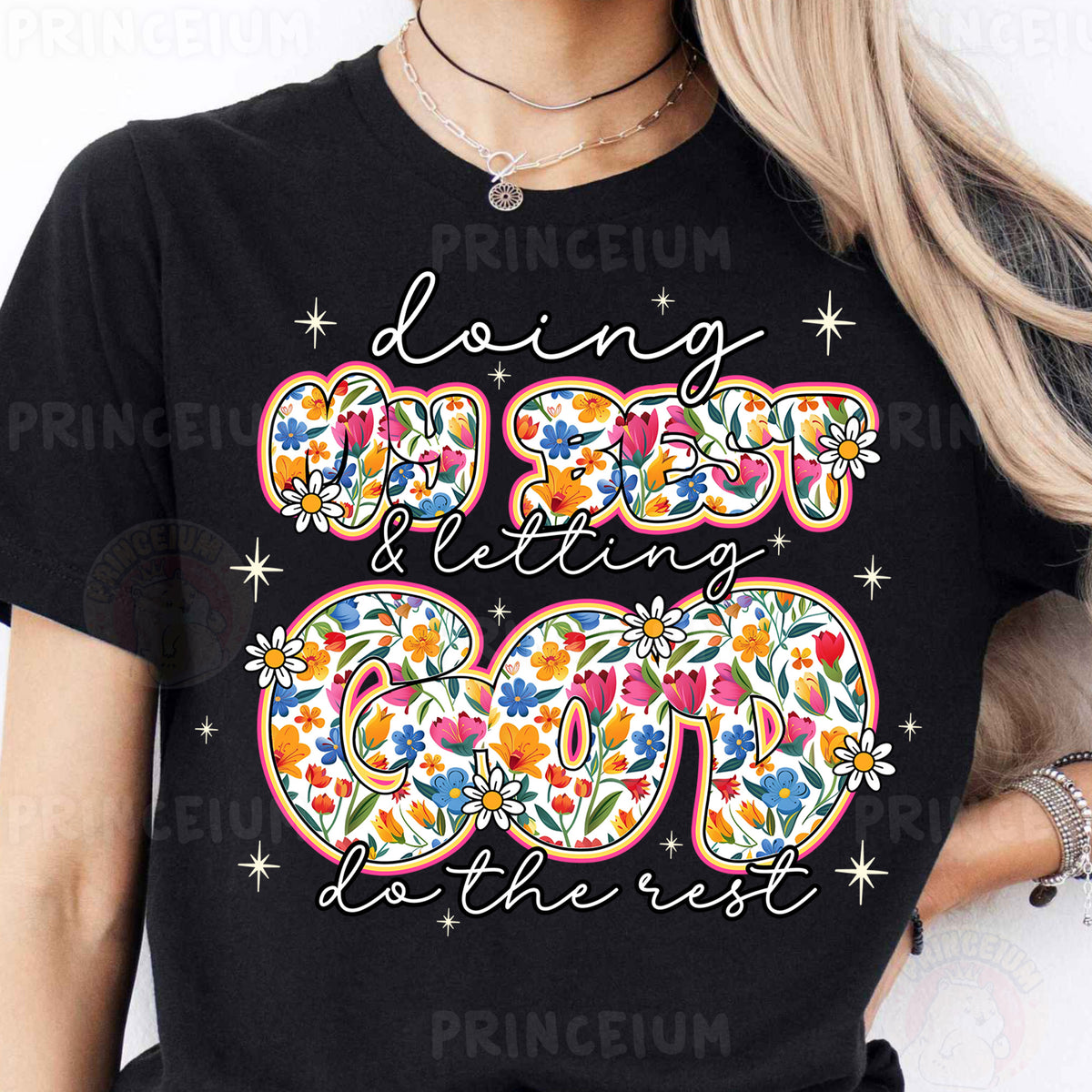 a woman wearing a black t - shirt with a floral design