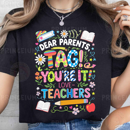 a woman wearing a t - shirt that says dear parents tag you're it
