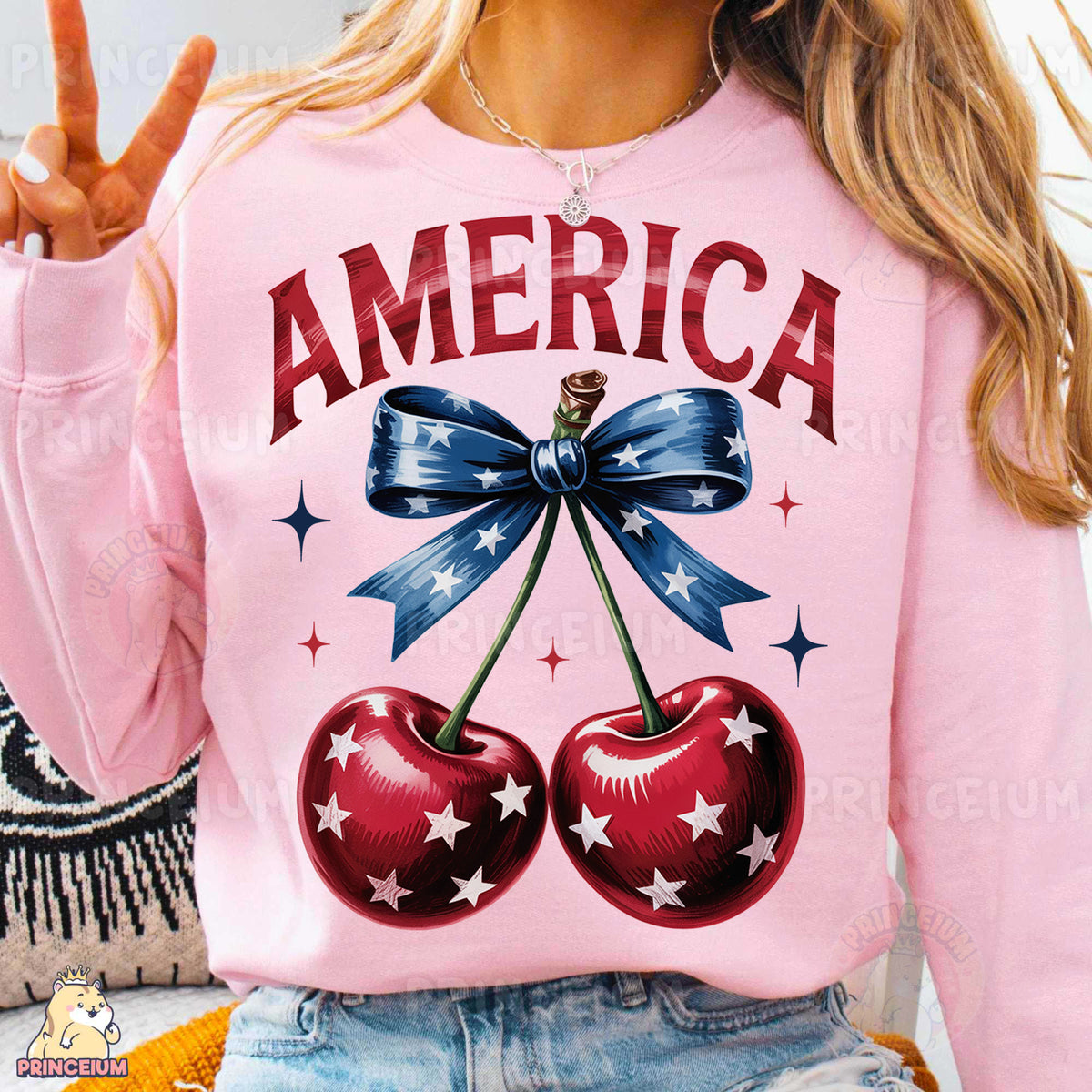 a woman wearing a pink sweatshirt with two cherries on it