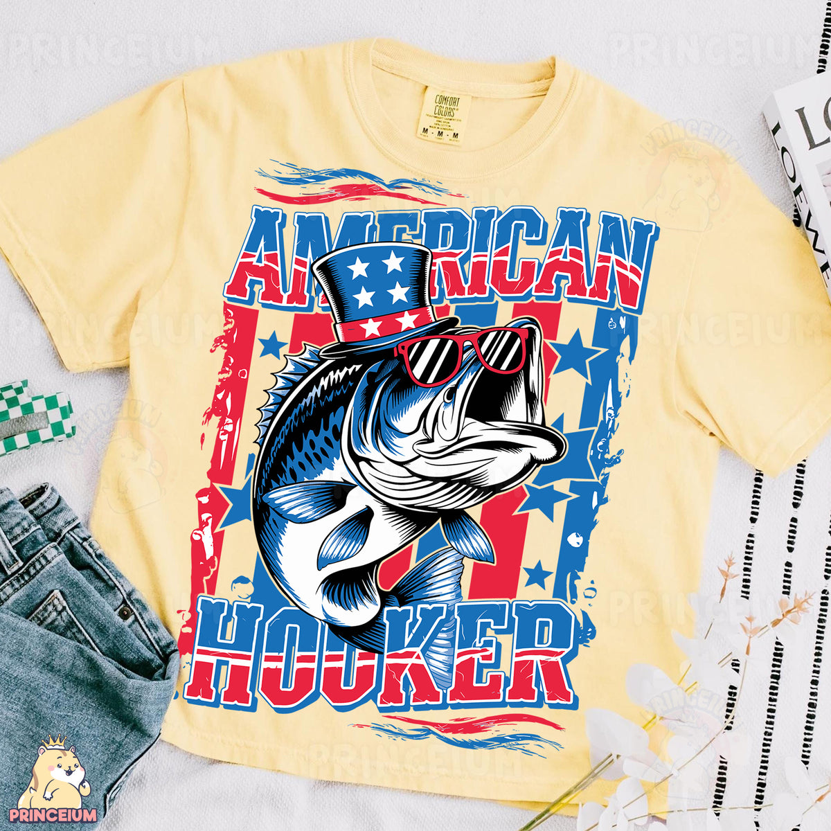 a t - shirt with a fish on it next to a pair of jeans