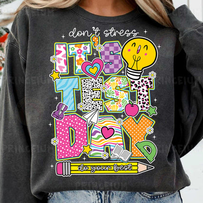 a woman wearing a sweatshirt that says don't stress it