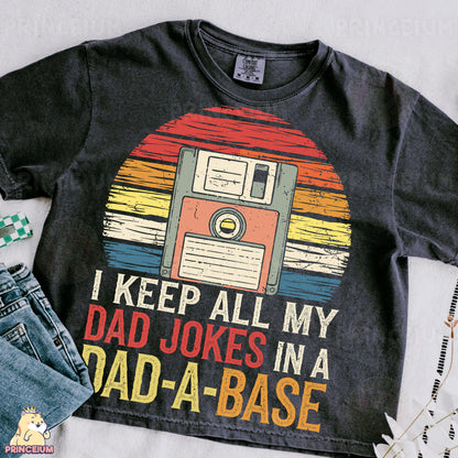 a t - shirt that says i keep all my dad jokes in a dad -