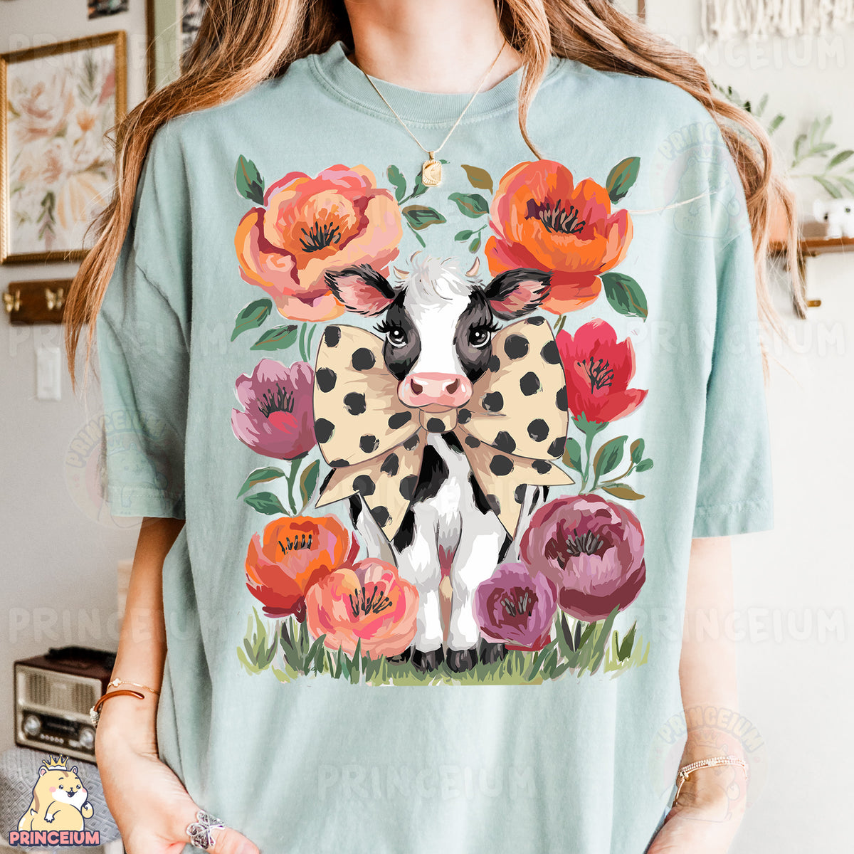 a woman wearing a t - shirt with a cow on it