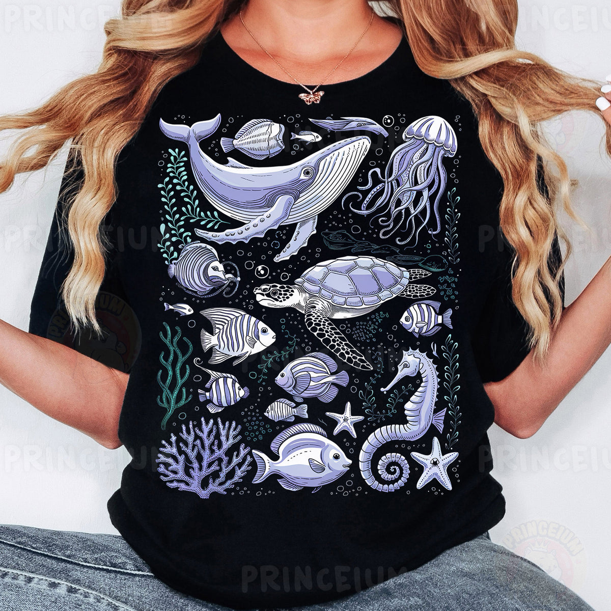 a woman wearing a black t - shirt with sea animals on it